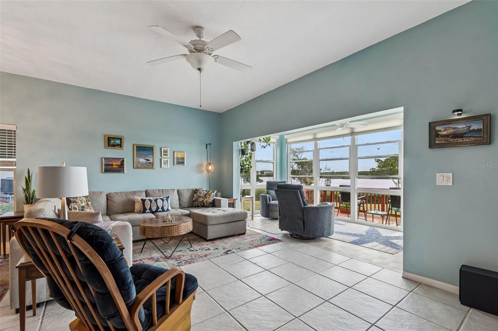 6499 99th Way North, Unit 18B St. Petersburg, FL 33708 - Photo 19 of 98 a living room with furniture and a large window