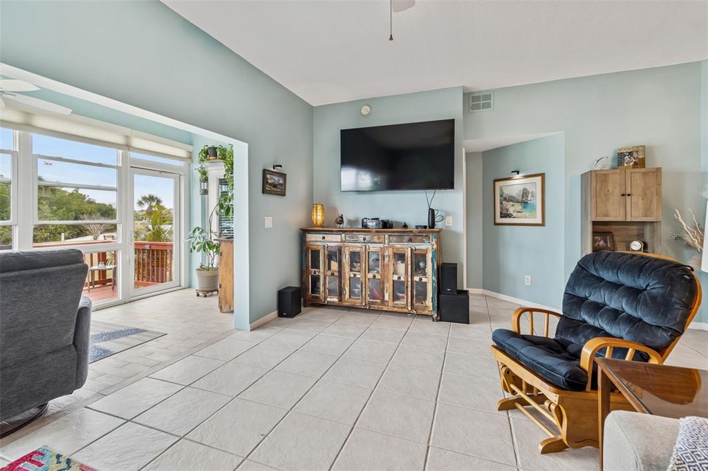 6499 99th Way North, Unit 18B St. Petersburg, FL 33708 - Photo 21 of 98 a living room with furniture and a flat screen tv