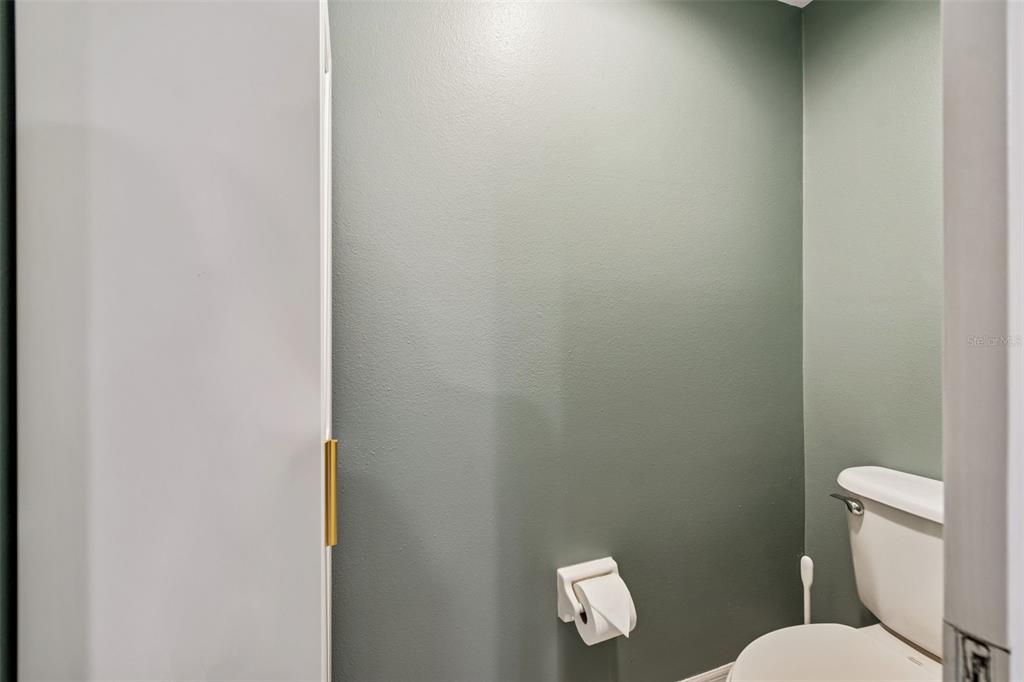 6499 99th Way North, Unit 18B St. Petersburg, FL 33708 - Photo 36 of 98 a white toilet sitting next to a white wall