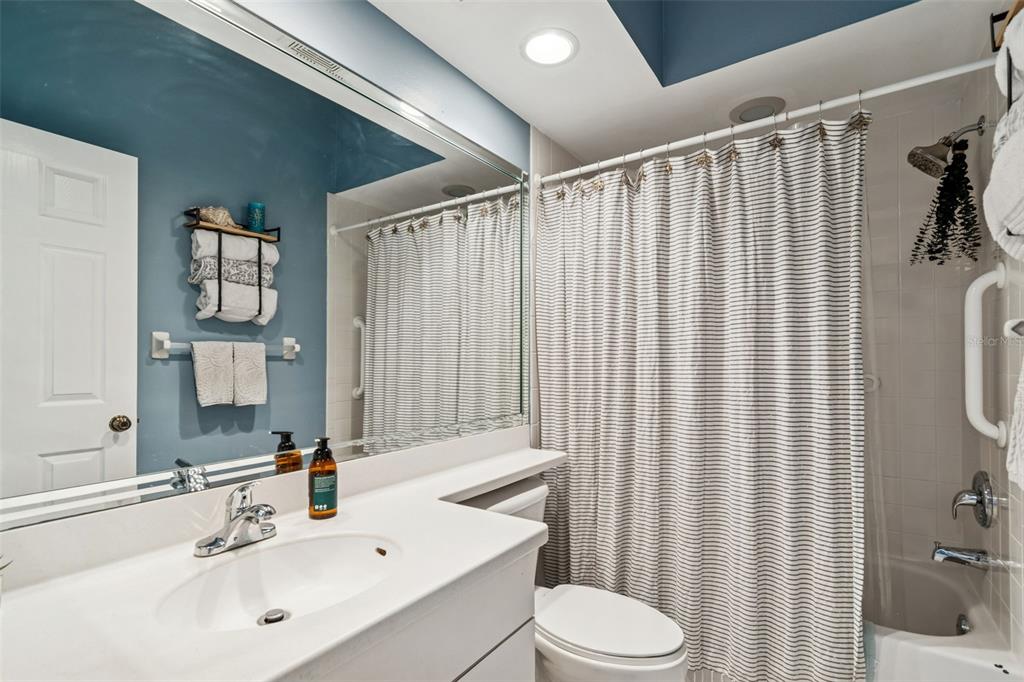 6499 99th Way North, Unit 18B St. Petersburg, FL 33708 - Photo 42 of 98 a bathroom with a sink toilet and shower