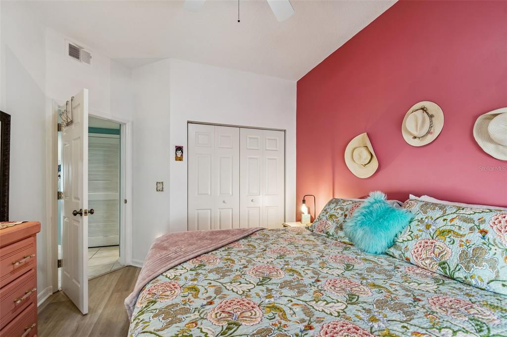 6499 99th Way North, Unit 18B St. Petersburg, FL 33708 - Photo 46 of 98 a bedroom with a bed and a window