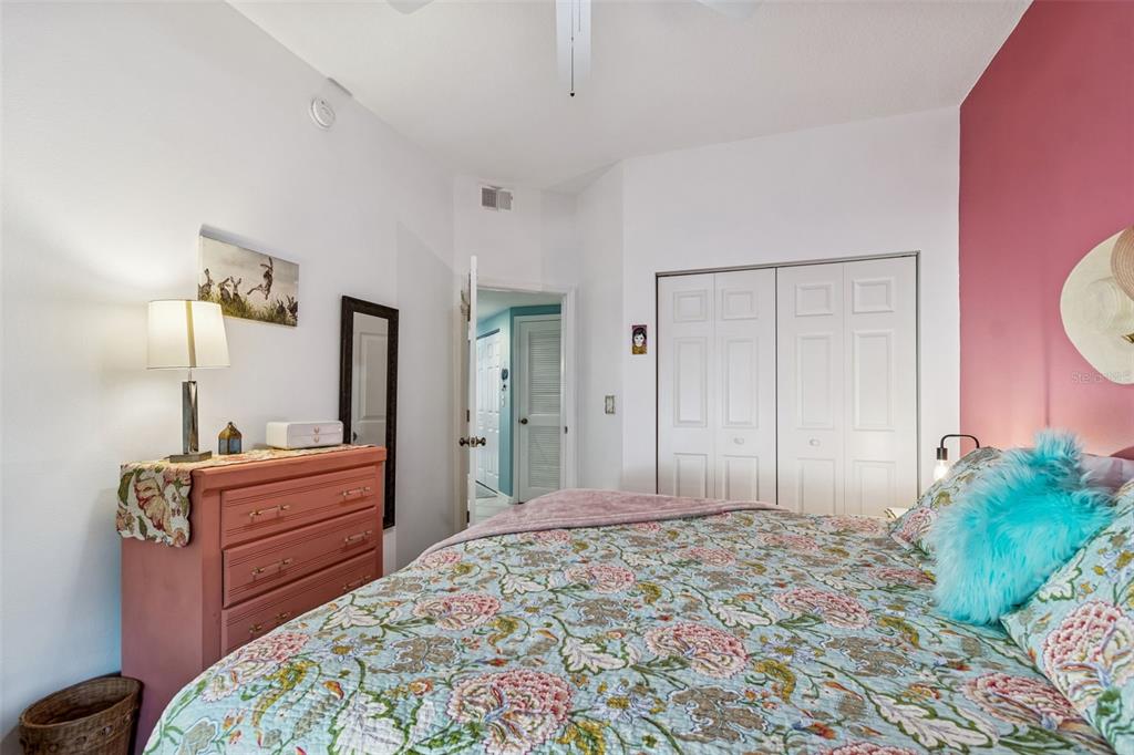 6499 99th Way North, Unit 18B St. Petersburg, FL 33708 - Photo 47 of 98 a bedroom with a bed and a dresser