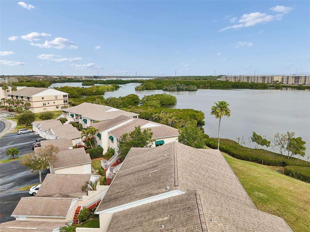 6499 99th Way North, Unit 18B St. Petersburg, FL 33708 - Photo 67 of 98 a view of a lake with houses