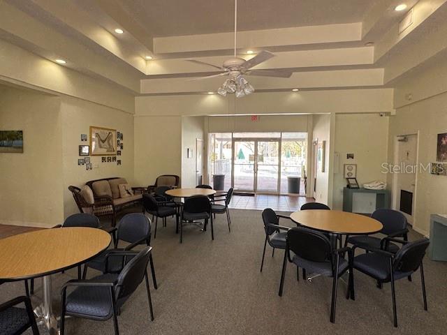 6499 99th Way North, Unit 18B St. Petersburg, FL 33708 - Photo 81 of 98 a view of a dining room with furniture and a chandelier