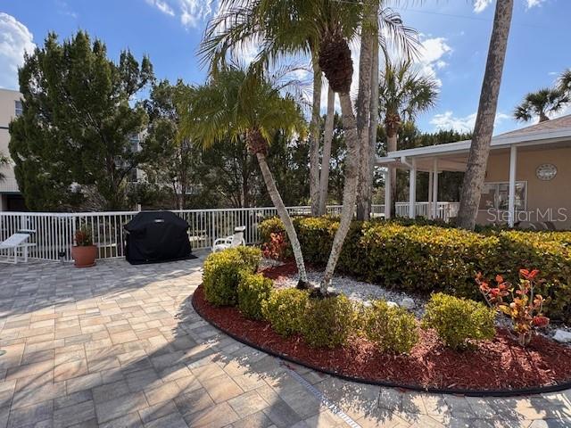 6499 99th Way North, Unit 18B St. Petersburg, FL 33708 - Photo 84 of 98 a view of a house with backyard and sitting area