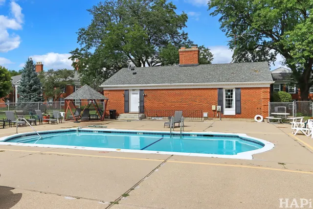 a view of a grassy field with trees