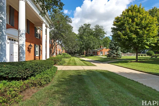 a view of building with trees in the background