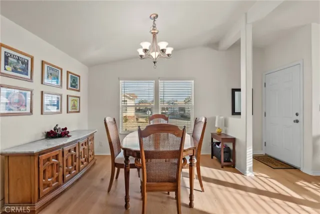 a dining room with furniture and window