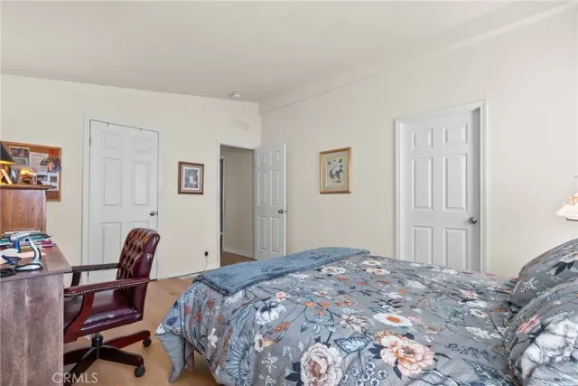 a view of hallway with window and cabinet