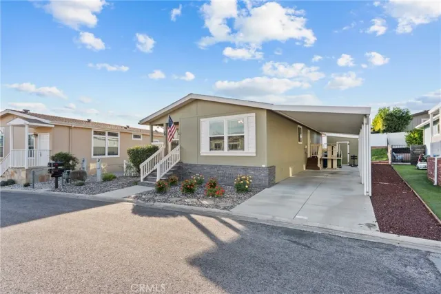 a front view of a house with sitting area