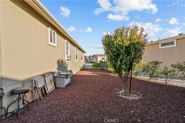 a view of a backyard with sitting area