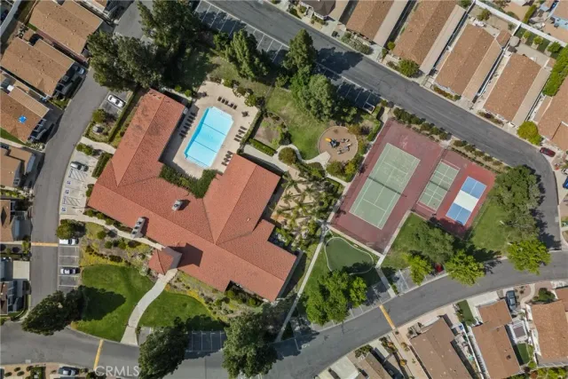 an aerial view of a house with yard swimming pool and mountain view