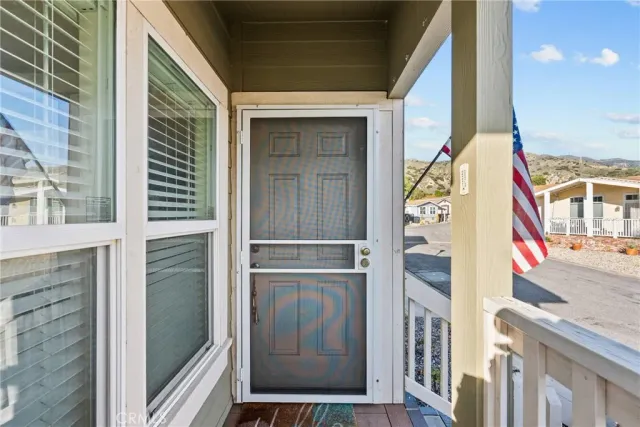 a dining room with furniture and a window
