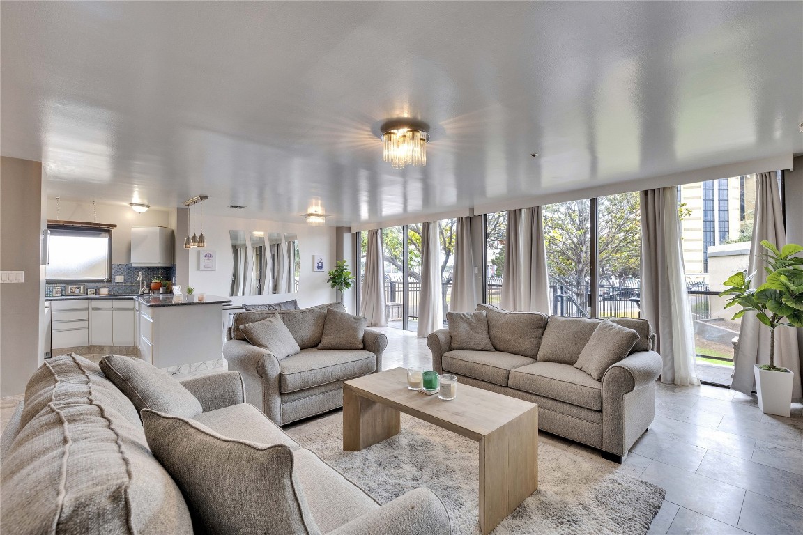 40 North Interstate Highway 35, Unit 2D4 Austin, TX 78701 - Photo 1 of 1 a living room with furniture and a large window