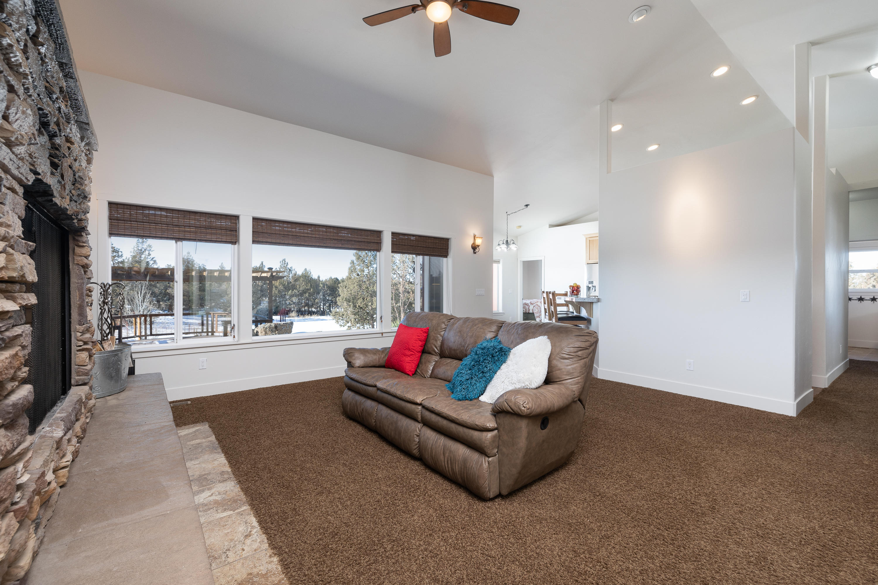 61822 Ten Barr Ranch Road Bend, OR 97701 - Photo 13 of 50 a living room with furniture and a large window