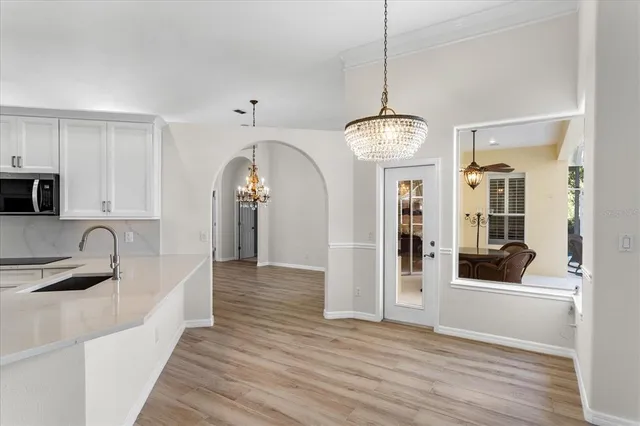 a view of a kitchen from the hallway