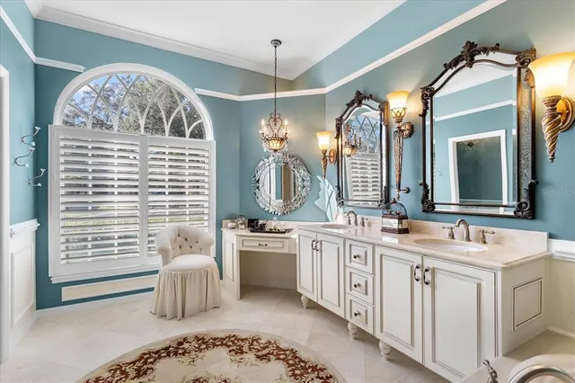 a spacious bathroom with a double vanity sink mirror and a bathtub