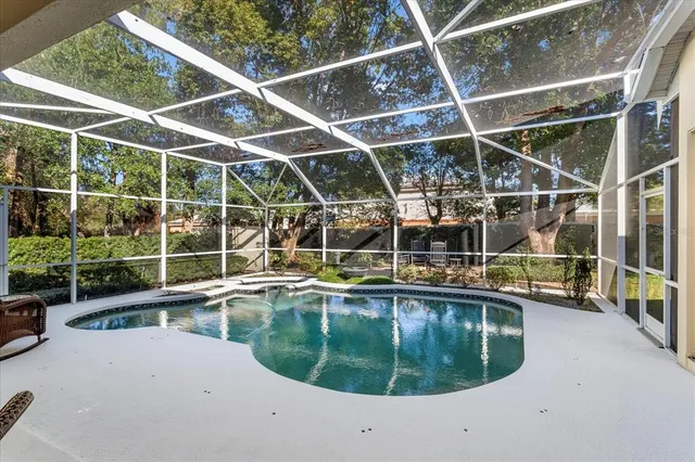 a view of a swimming pool with a yard