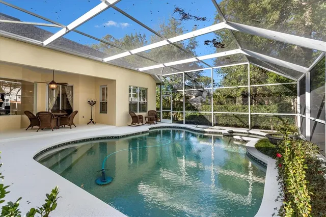 a view of a swimming pool with a patio