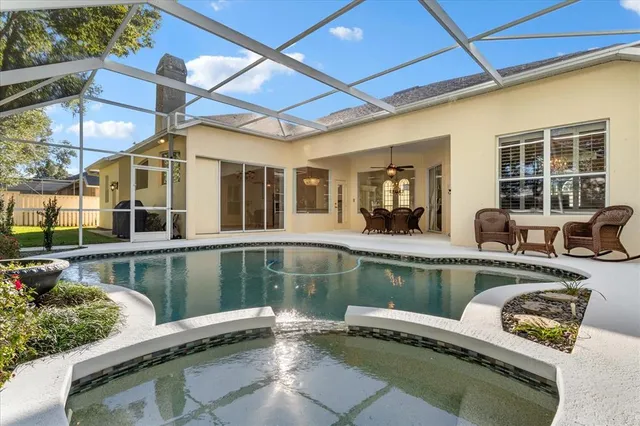 a view of a swimming pool with a patio