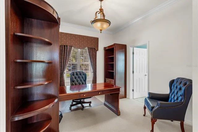 a room with furniture pool table and windows