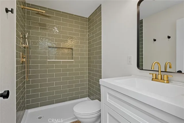 a view of empty room with wooden floor and window