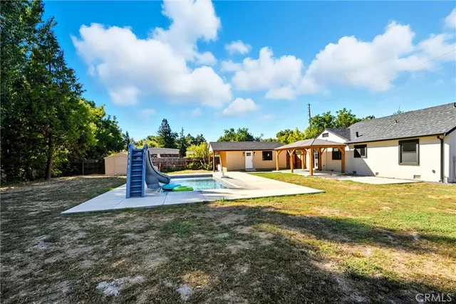 a view of a swimming pool with a patio