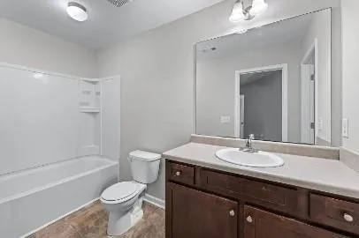 a view of a house with a yard and chairs