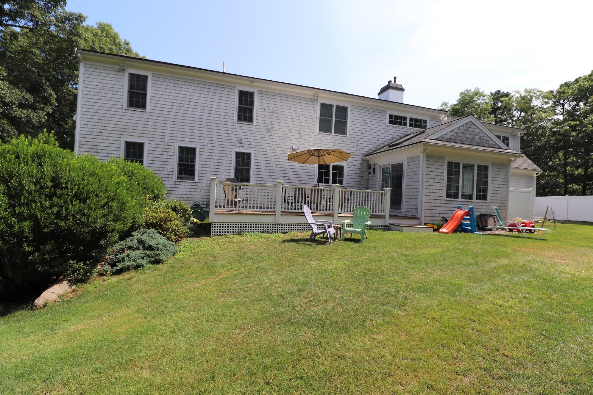 11 Hi River Road Marstons Mills, MA 02648 - Photo 3 of 21 a front view of house with yard and seating area
