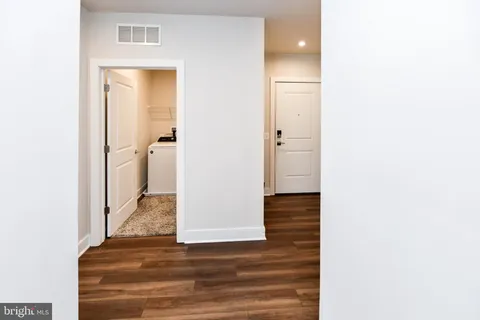 a bathroom with a double vanity sink and mirror