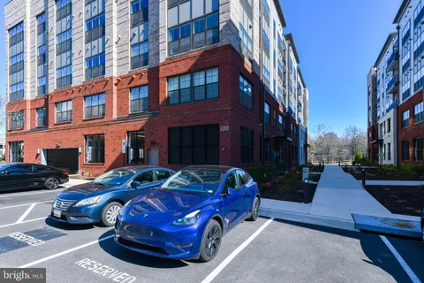 a front view of a building with parking space