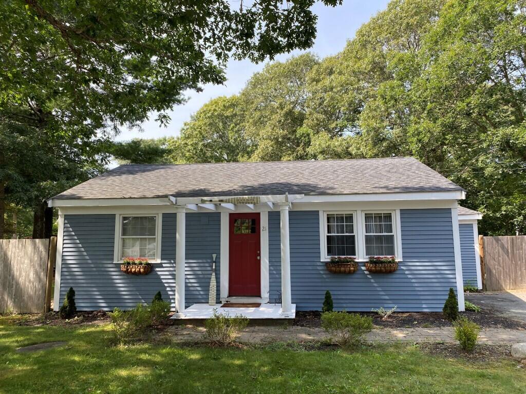 21 Mashpee Neck Road Mashpee, MA 02649 - Photo 1 of 17 a view of house with backyard