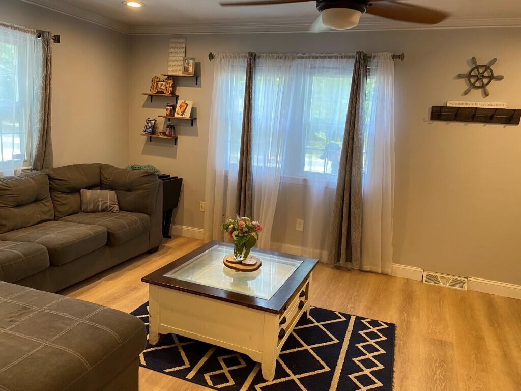 21 Mashpee Neck Road Mashpee, MA 02649 - Photo 7 of 17 a living room with furniture and wooden floor
