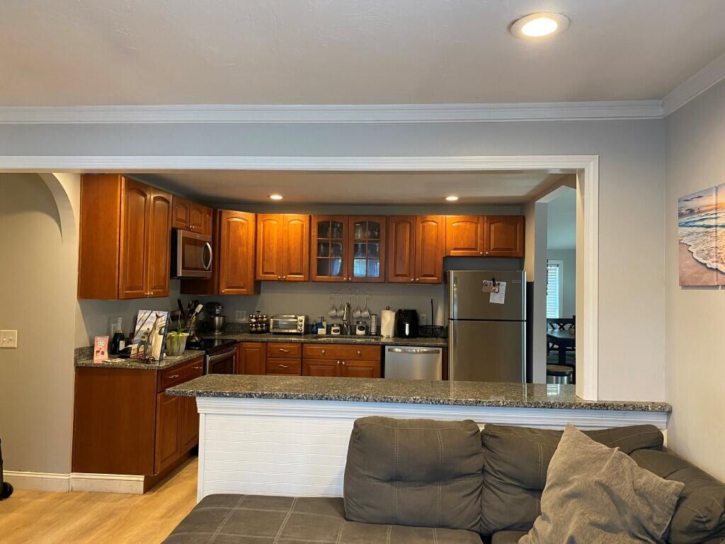 21 Mashpee Neck Road Mashpee, MA 02649 - Photo 10 of 17 a living room with furniture and a large window