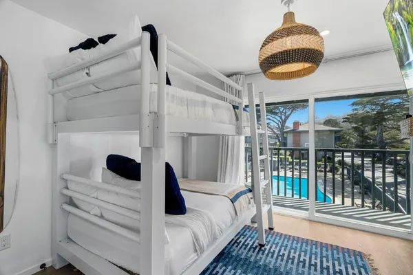 a bedroom with a bed and a mirror