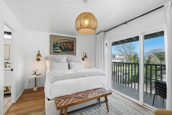 a bathroom with a sink toilet mirror and shower