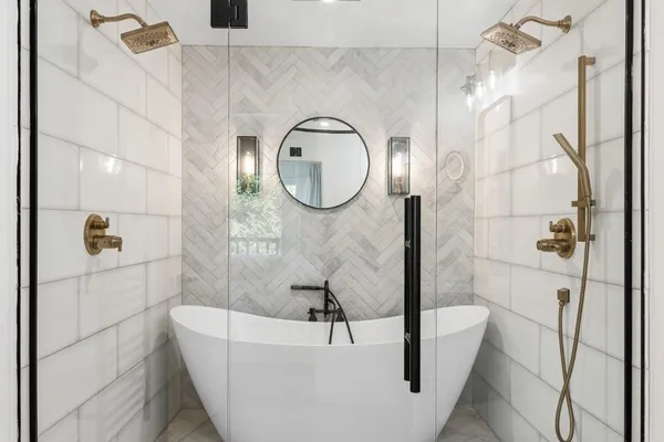 a bathroom with a toilet and a shower