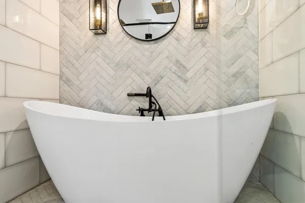 a bathroom with a sink vanity and a mirror