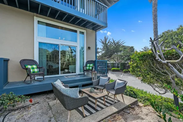 a patio with patio table and chairs