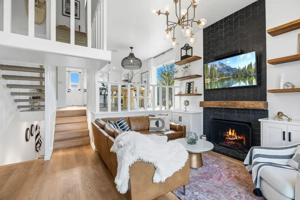 a living room with fireplace furniture and a flat screen tv