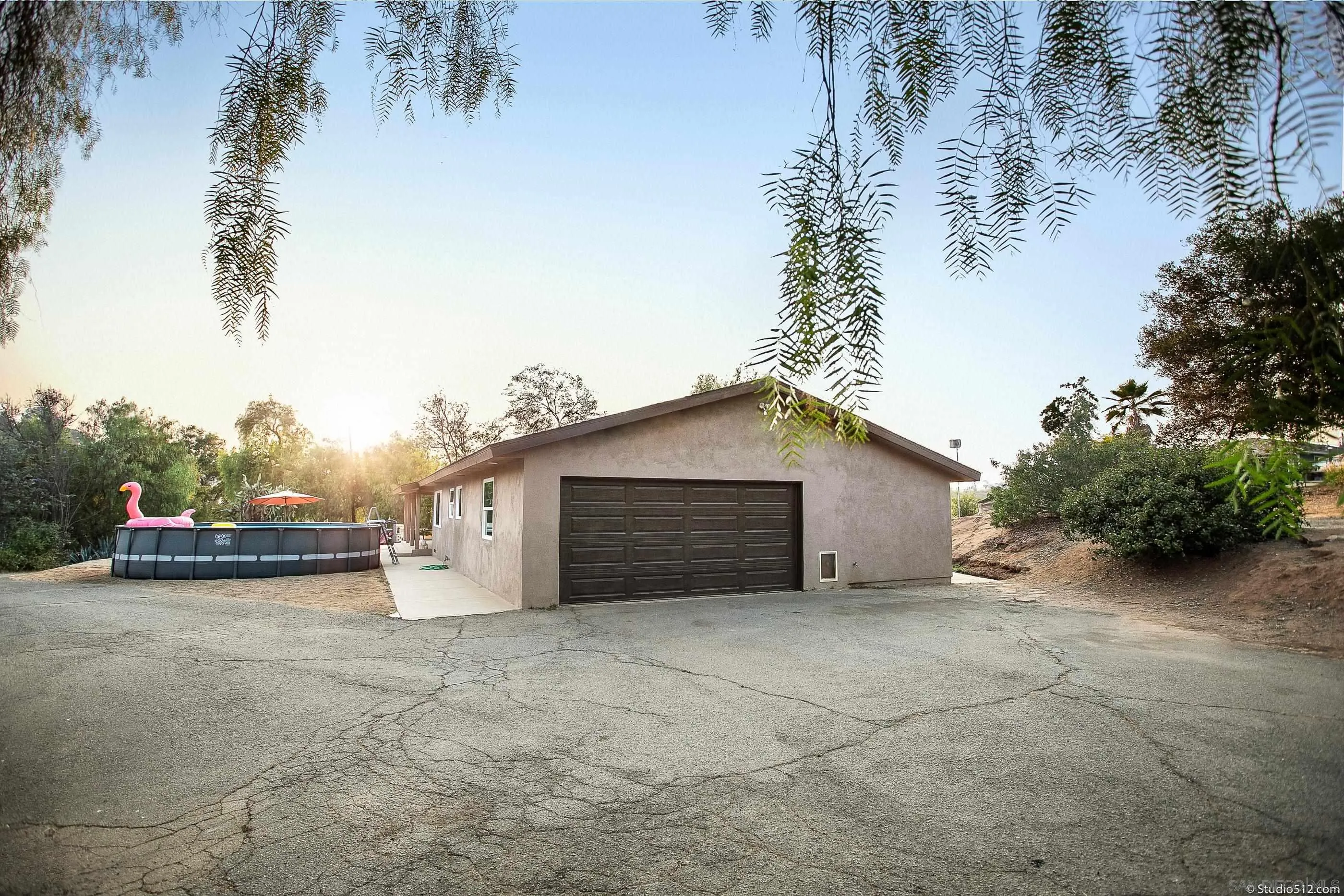 31151 Lilac Road Valley Center, CA 92082 - Photo 22 of 25 a view of a house with a garage