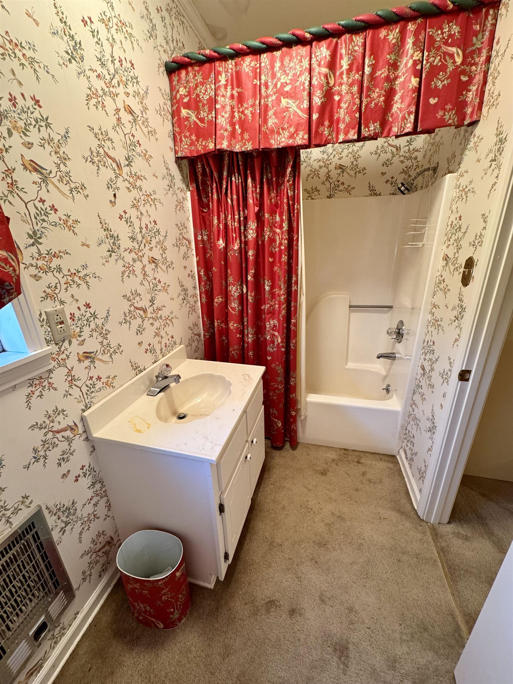 1015 Crestview Street Covington, TN 38019 - Photo 13 of 33 a spacious bathroom with a sink a mirror and a bathtub