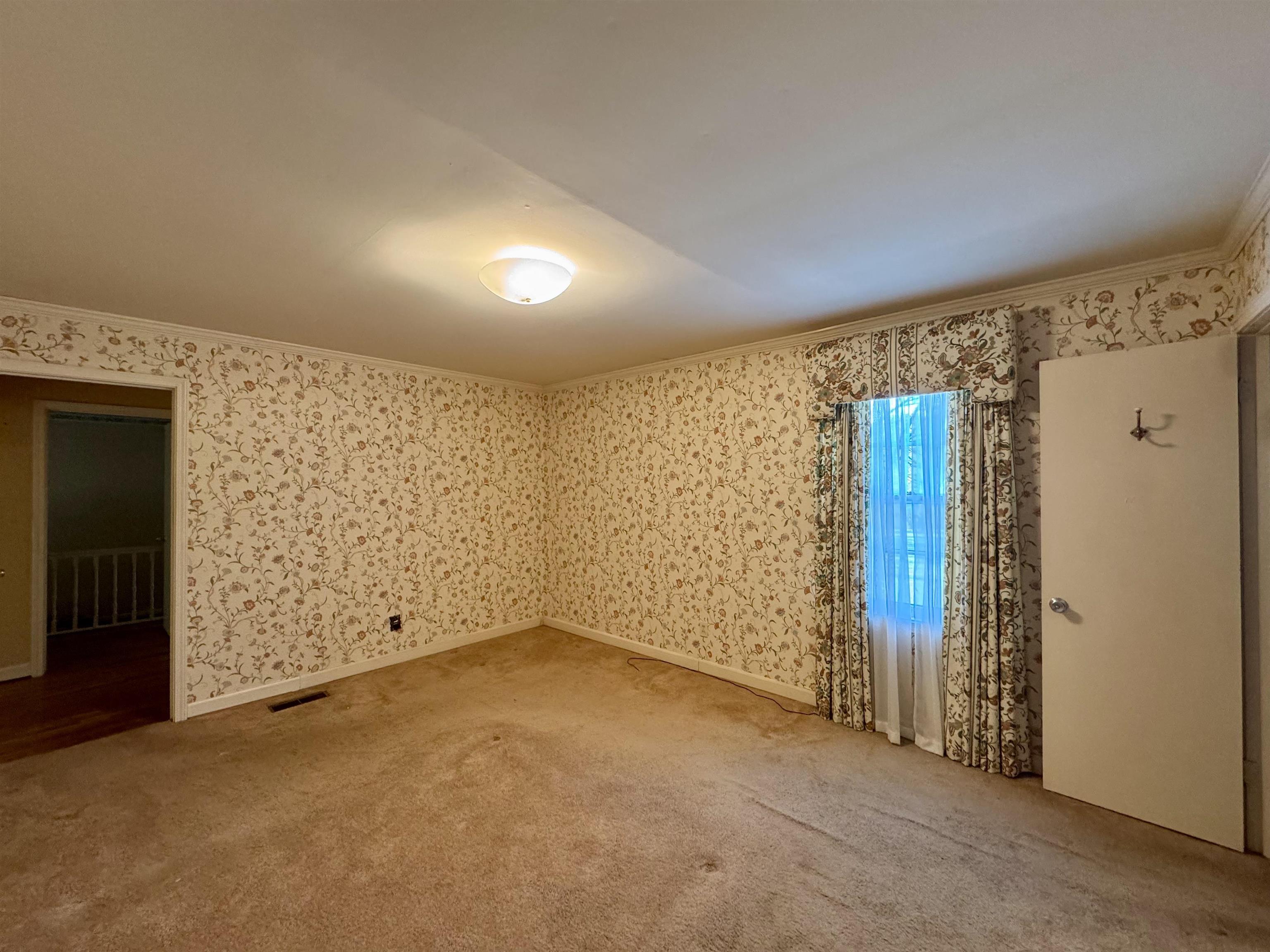 1015 Crestview Street Covington, TN 38019 - Photo 16 of 33 an empty room with windows