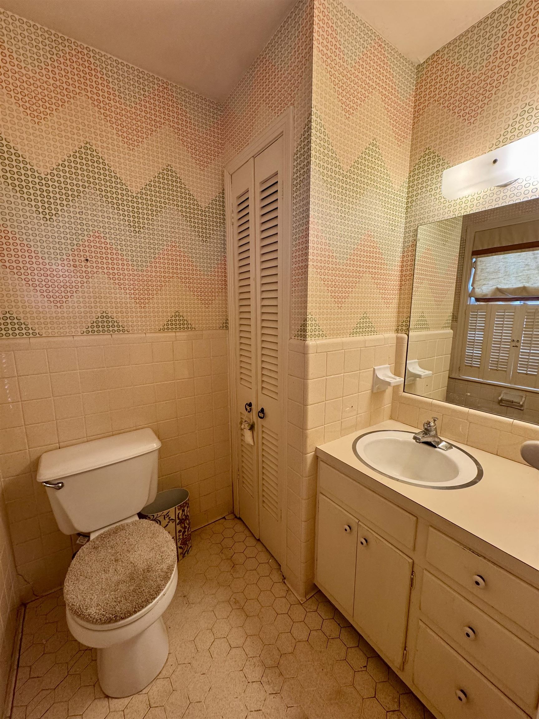 1015 Crestview Street Covington, TN 38019 - Photo 18 of 33 a bathroom with a toilet sink and mirror