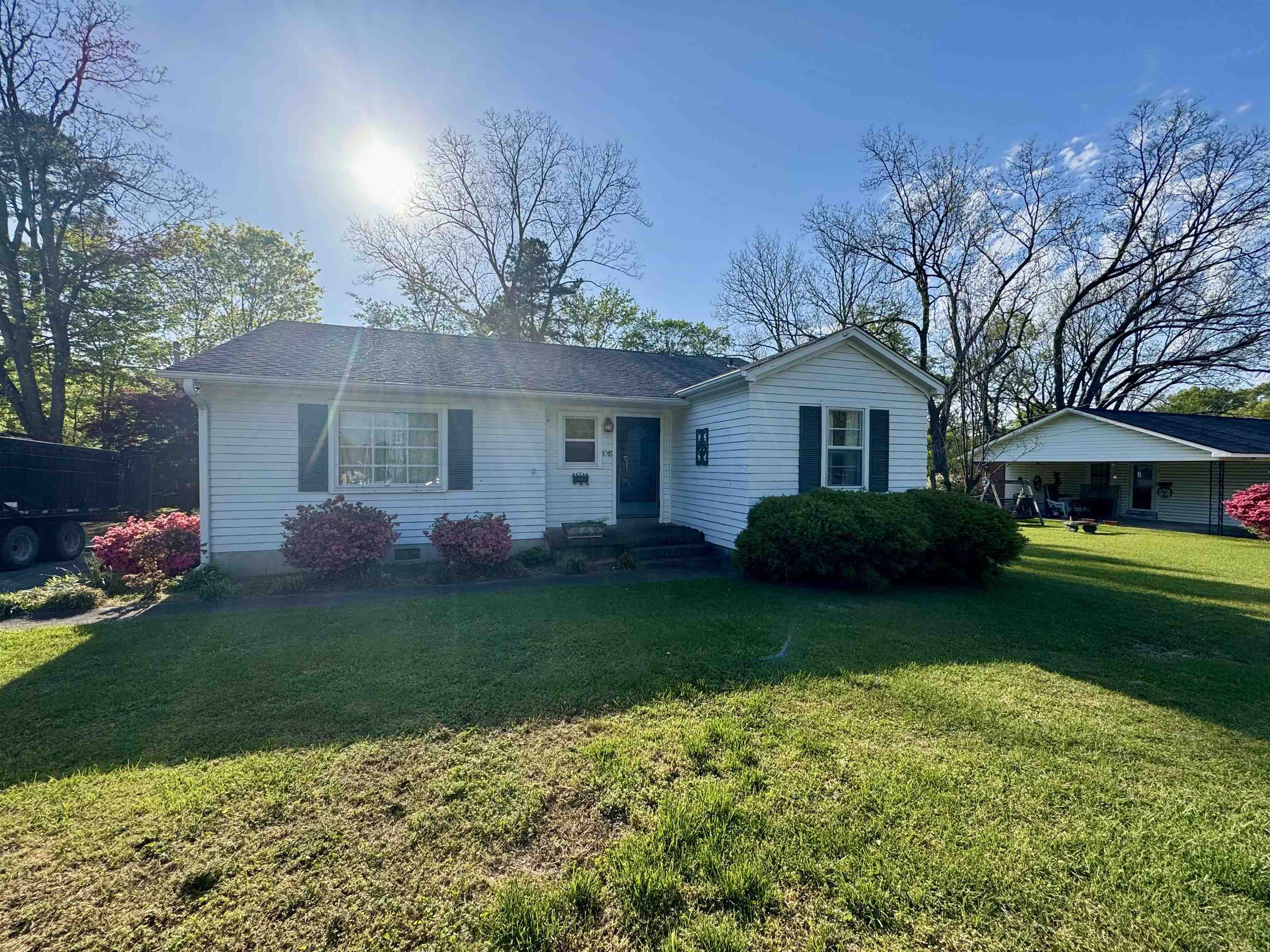 1015 Crestview Street Covington, TN 38019 - Photo 2 of 33 a front view of a house with garden