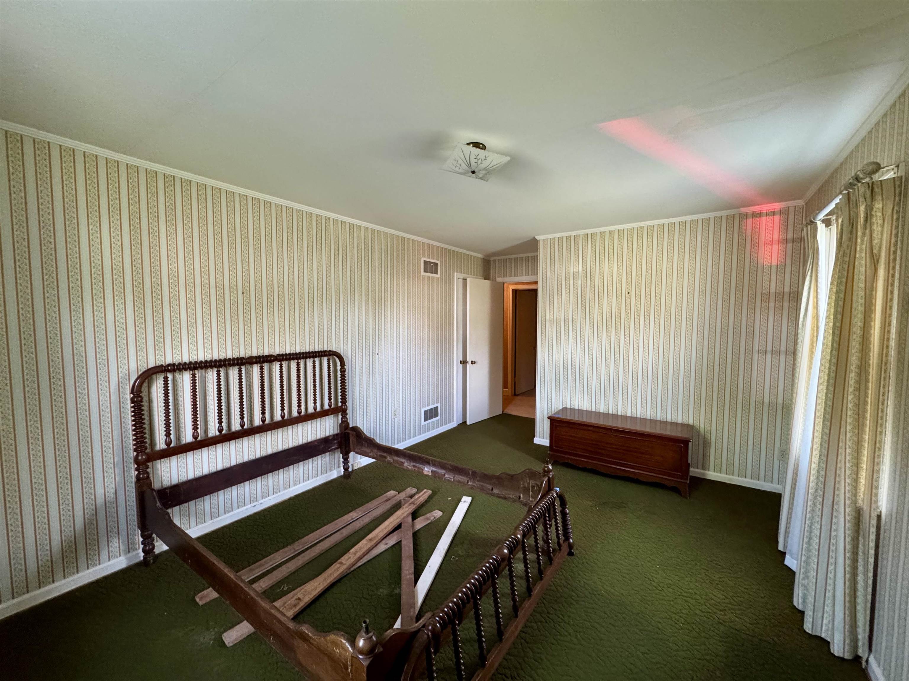 1015 Crestview Street Covington, TN 38019 - Photo 22 of 33 a bedroom with a bed and a window