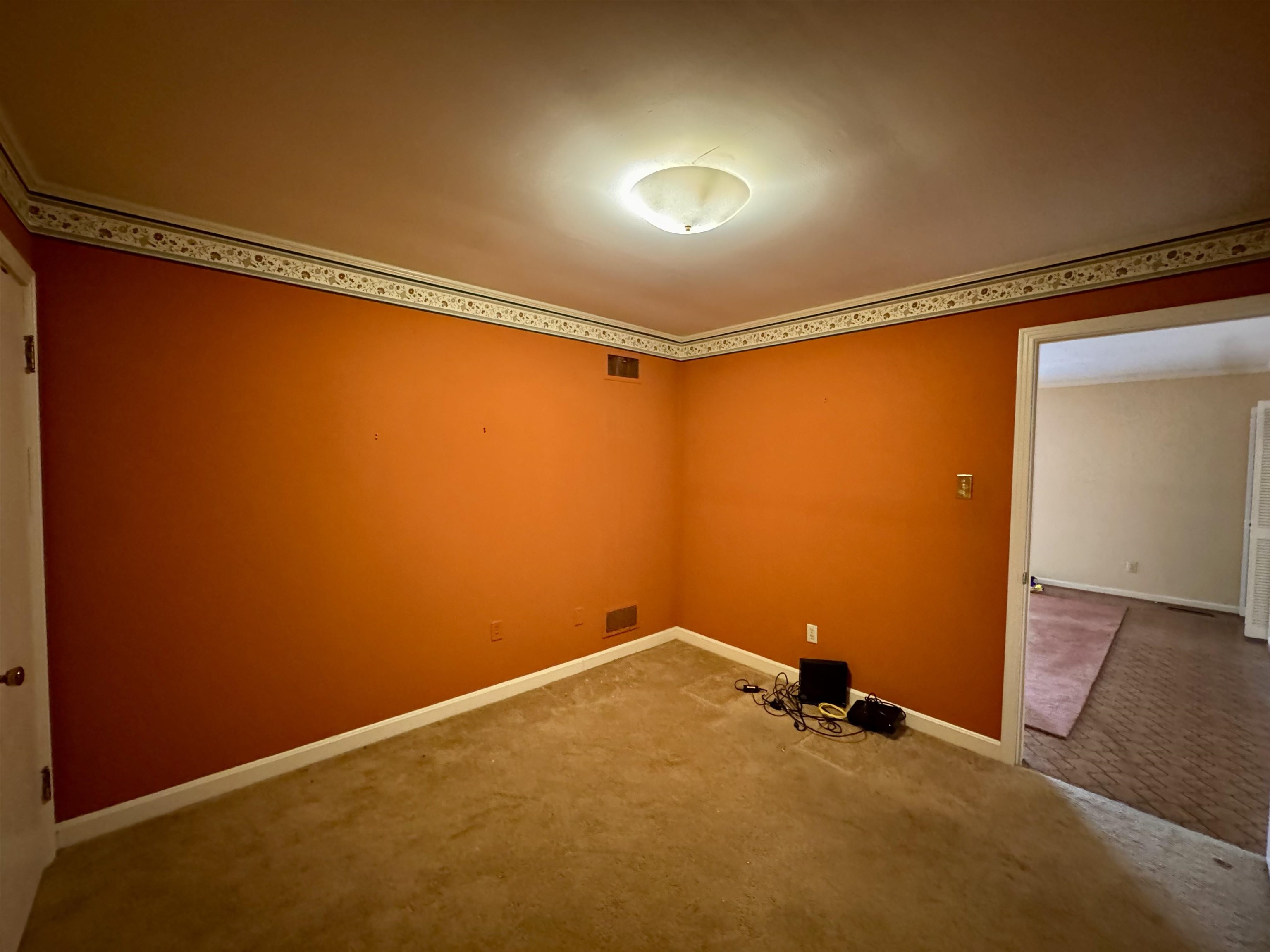 1015 Crestview Street Covington, TN 38019 - Photo 24 of 33 a view of a room with closet and wooden floor