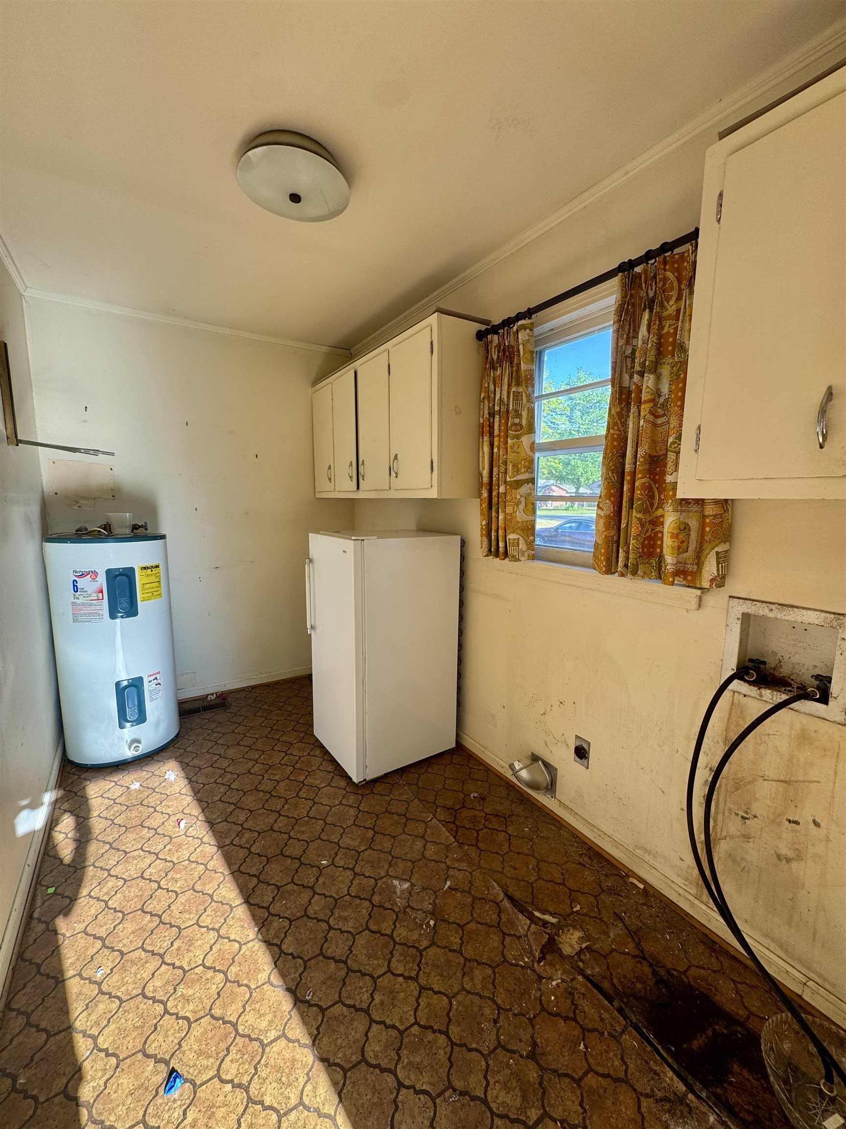1015 Crestview Street Covington, TN 38019 - Photo 26 of 33 a view of a storage & utility room with a window