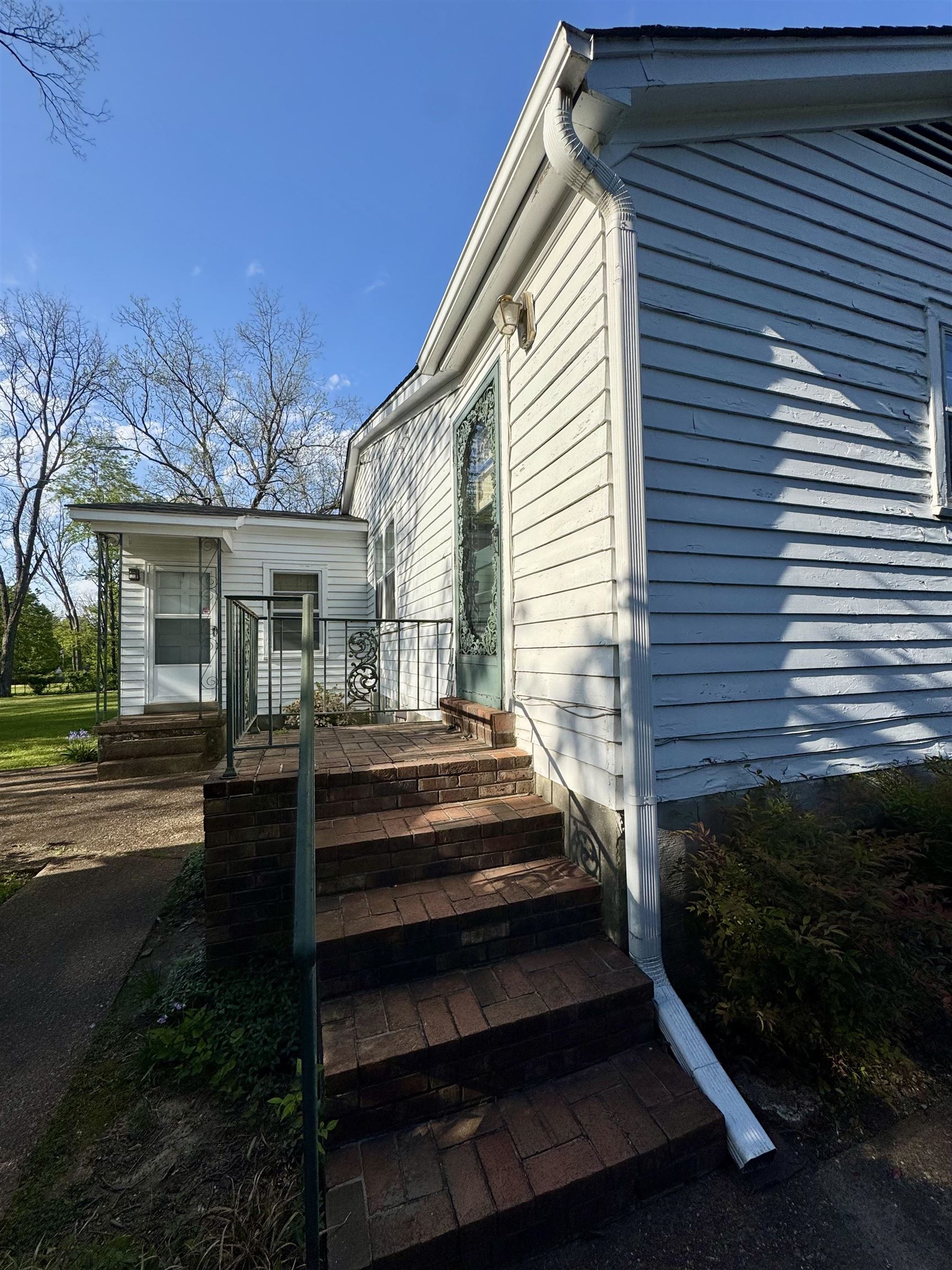 1015 Crestview Street Covington, TN 38019 - Photo 28 of 33 a front view of a house with a garden