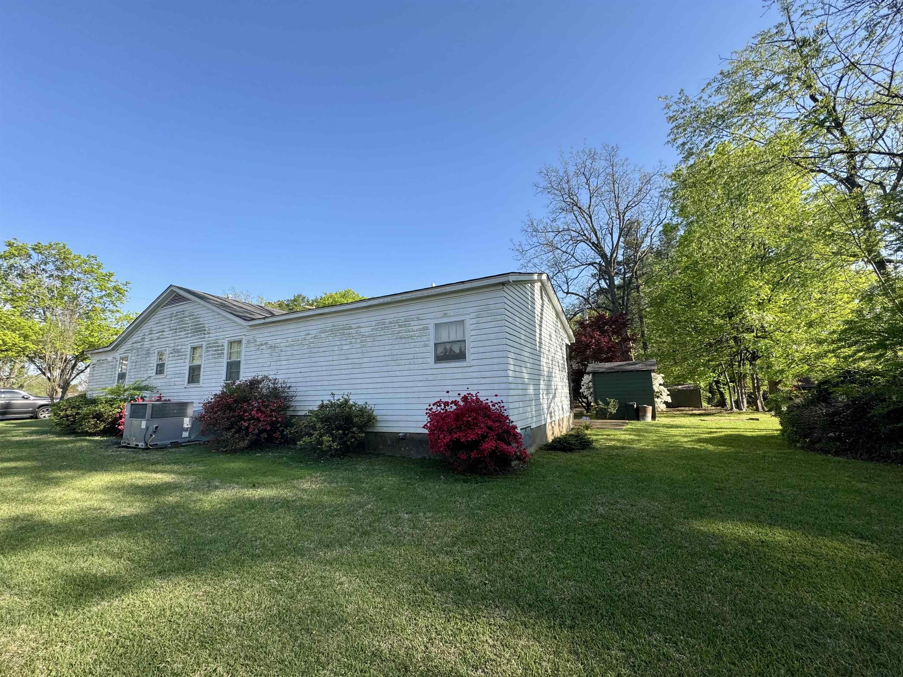 1015 Crestview Street Covington, TN 38019 - Photo 32 of 33 a front view of a house with garden